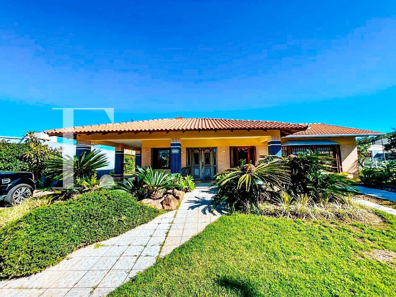Casa com 290m², 4 dormitórios, 4 suítes, 2 vagas, no bairro Atlântida em Xangri-Lá