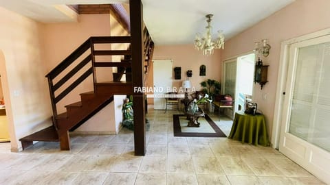 Casa com 180m², 5 dormitórios, 1 suíte, no bairro Atlântida em Xangri-Lá