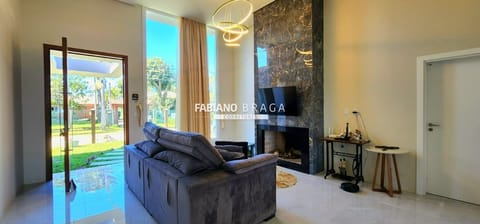 Casa com 165m², 3 dormitórios, 2 suítes, 2 vagas, no bairro Atlântida em Xangri-Lá