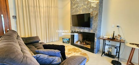 Casa com 165m², 3 dormitórios, 2 suítes, 2 vagas, no bairro Atlântida em Xangri-Lá