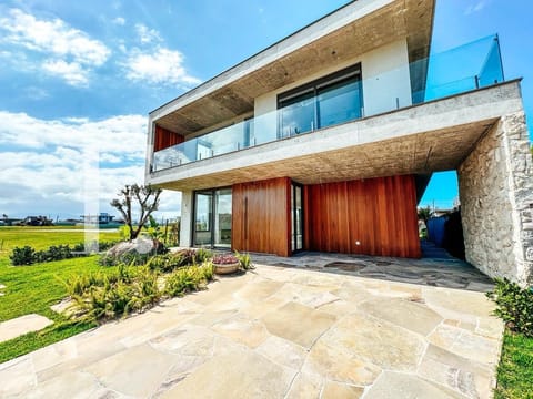 Sobrado com 408m², 4 dormitórios, 4 suítes, 2 vagas, Amare Home Resort em Xangri-Lá