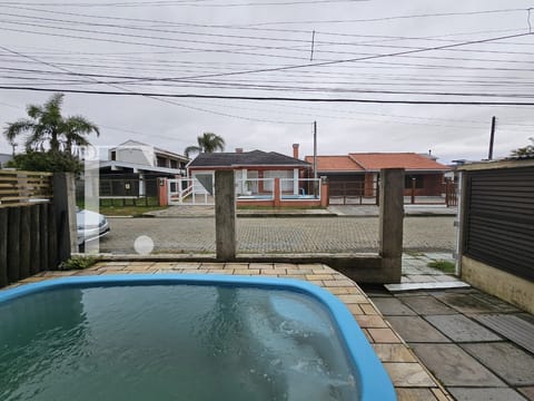 Casa com 125m², 3 dormitórios, 1 suíte, 1 vaga, no bairro Centro em Xangri-Lá