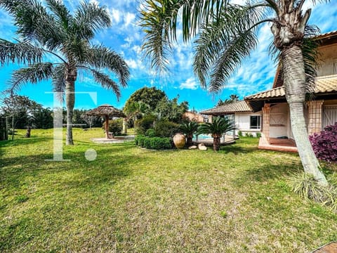 Casa com 420m², 4 dormitórios, 1 suíte, 2 vagas, no bairro Atlântida em Xangri-Lá
