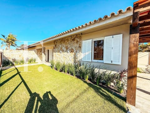Casa com 100m², 3 dormitórios, 1 vaga, no bairro Centro em Xangri-Lá