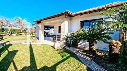 Casa com 130m², 3 dormitórios, 1 suíte, 3 vagas, no bairro Noiva do Mar em Xangri-Lá