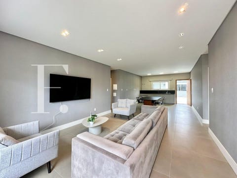 Casa com 187m², 4 dormitórios, 4 suítes, 2 vagas, no bairro Atlântida em Xangri-Lá