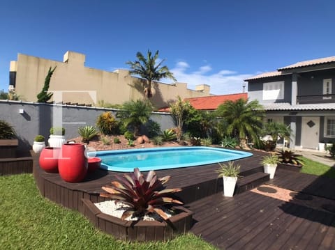 Casa com 242m², 5 dormitórios, 2 suítes, 2 vagas, no bairro Centro em Xangri-Lá