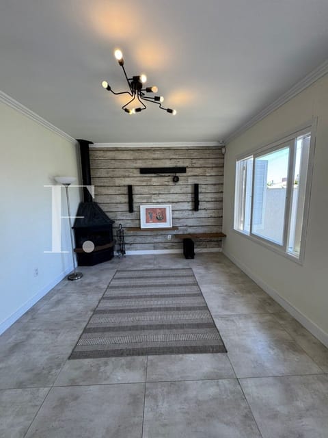 Casa com 118m², 3 dormitórios, 2 suítes, 2 vagas, no bairro Remanso em Xangri-Lá
