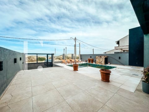 Casa com 275m², 4 dormitórios, 4 suítes, 6 vagas, no bairro Centro em Xangri-Lá