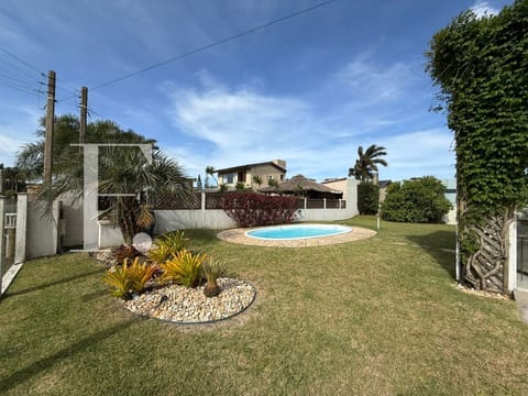 Casa com 151m², 3 dormitórios, 1 suíte, 4 vagas, no bairro Atlântida em Xangri-Lá