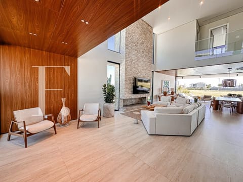 Sobrado com 434m², 5 dormitórios, 5 suítes, 2 vagas, Lótus em Xangri-Lá