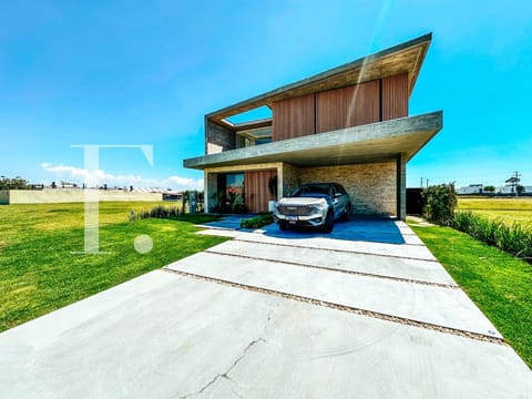 Sobrado com 434m², 5 dormitórios, 5 suítes, 2 vagas, Lótus em Xangri-Lá
