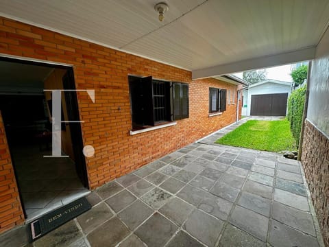 Casa com 206m², 2 dormitórios, 1 suíte, 2 vagas, no bairro Centro em Xangri-Lá