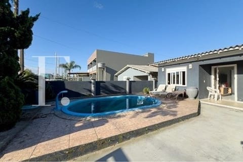 Casa com 198m², 3 dormitórios, 2 vagas, no bairro Noiva do Mar em Xangri-Lá
