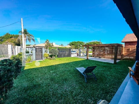 Casa com 245m², 5 dormitórios, 2 suítes, 2 vagas, no bairro Atlântida em Xangri-Lá