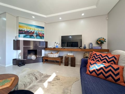 Casa com 180m², 3 dormitórios, 2 suítes, 2 vagas, no bairro Noiva do Mar em Xangri-Lá
