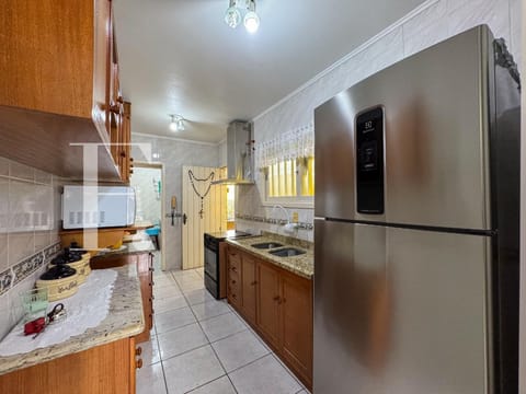 Casa com 166m², 3 dormitórios, 1 suíte, 3 vagas, no bairro Centro em Xangri-Lá