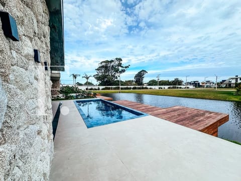 Sobrado com 361m², 5 dormitórios, 5 suítes, 2 vagas, Amare Home Resort em Xangri-Lá