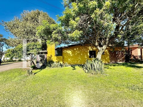 Casa com 110m², 4 dormitórios, 2 suítes, 2 vagas, no bairro Rainha do Mar em Xangri-Lá