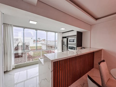 Apartamento com 70m², 2 dormitórios, 1 suíte, 1 vaga, Edifício Maison Meneghoto em Xangri-Lá