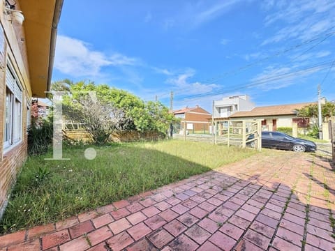 Casa com 106m², 3 dormitórios, 2 vagas, no bairro Rainha do Mar em Xangri-Lá