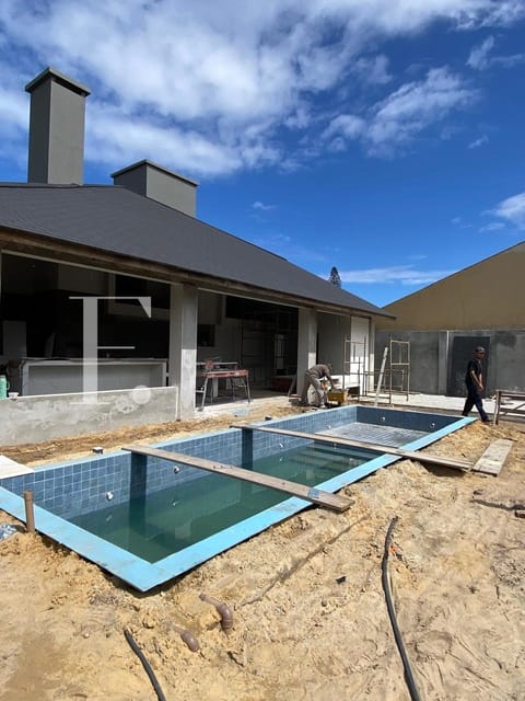 Casa com 520m², 4 dormitórios, 4 suítes, no bairro Atlântida em Xangri-Lá